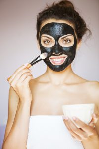 Woman Applying Facial Cream